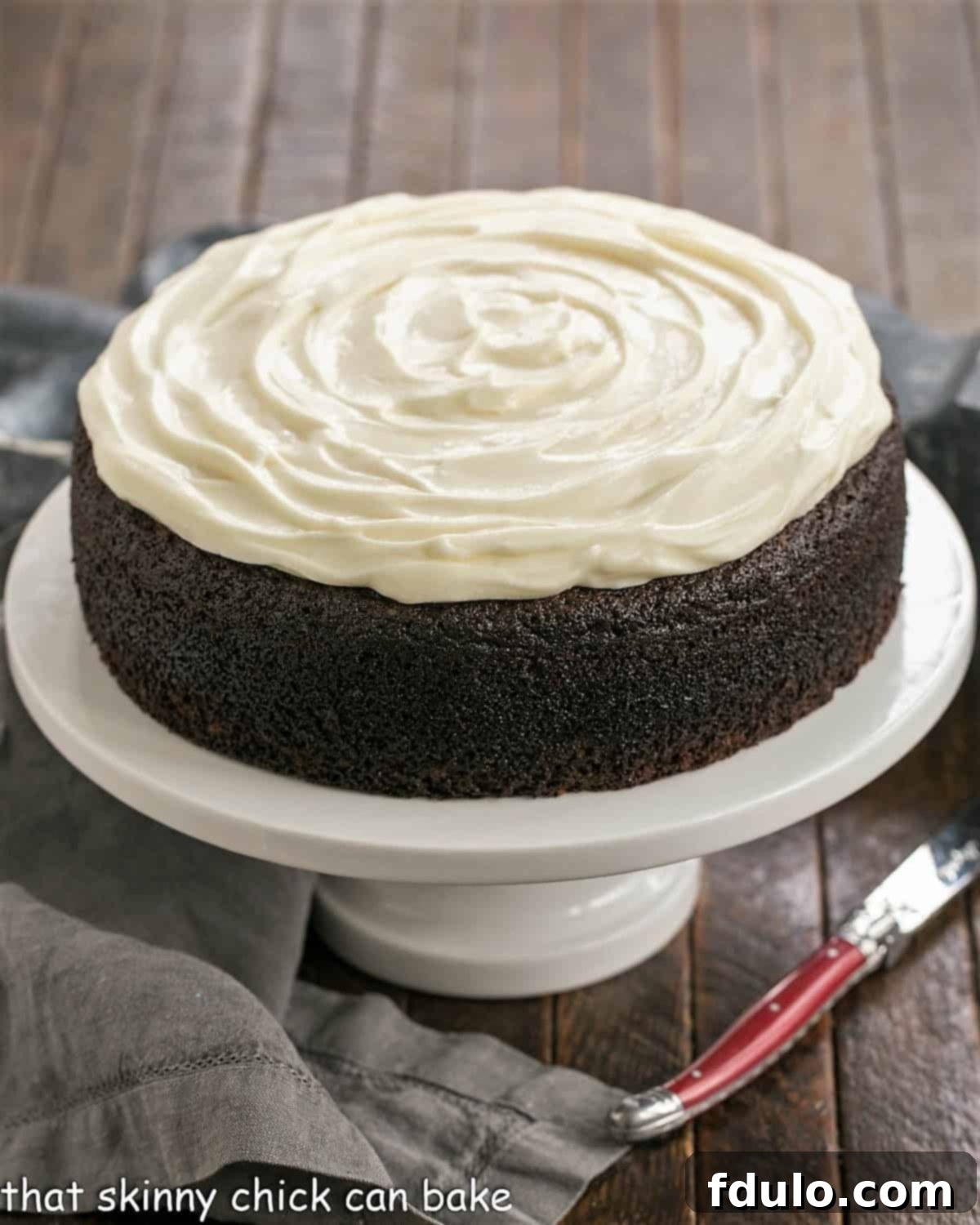 Rich, moist Chocolate Guinness Cake topped with fluffy cream cheese icing, perfect for St. Patrick's Day dessert.