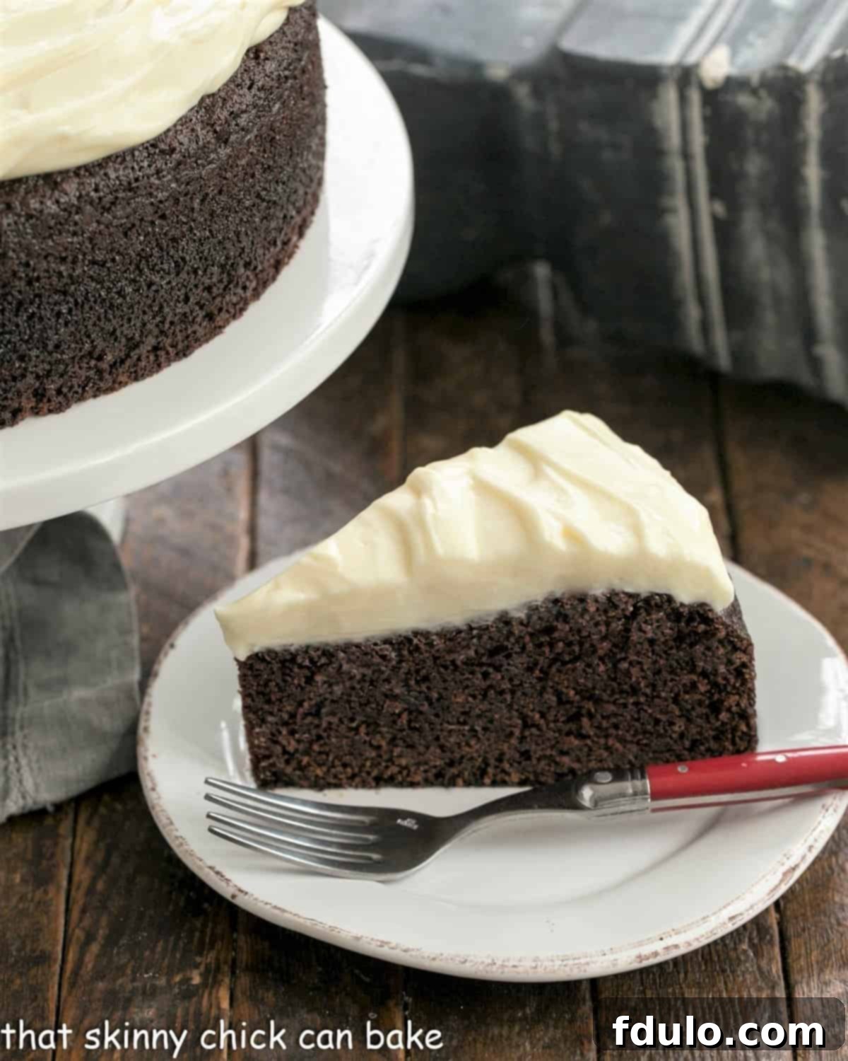 Overhead view of a perfectly frosted Chocolate Guinness Cake, showcasing its rich texture and inviting cream cheese topping.