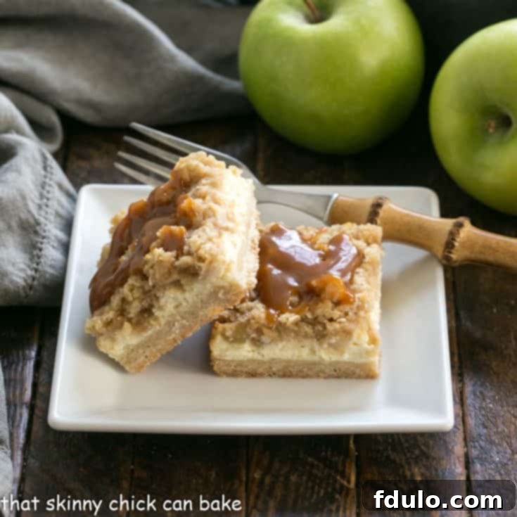 Apple Cheesecake Bars on a square white plate