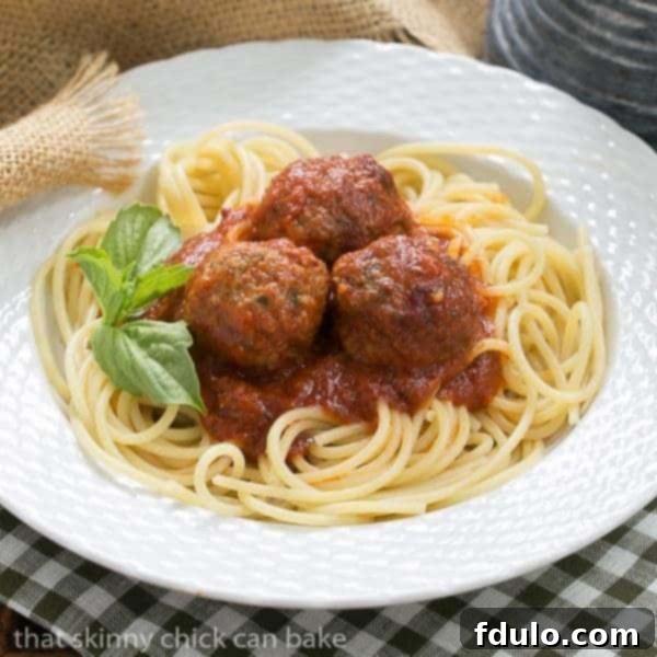 Delicious Spaghetti with Sunday Gravy, slow-simmered with meatballs, sausage, and pork ribs