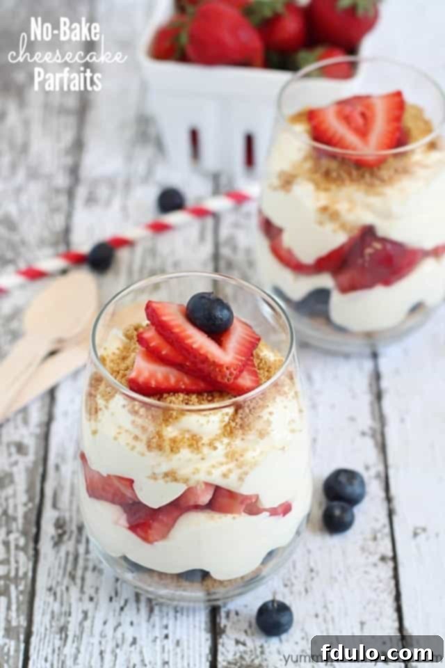 Gorgeous No-Bake Cheesecake Parfaits, loaded with fresh berries.