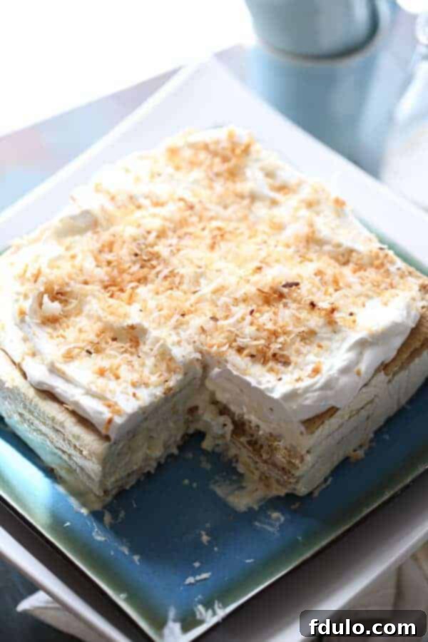 Light and creamy Vanilla Coconut Ice Box Cake with graham crackers.