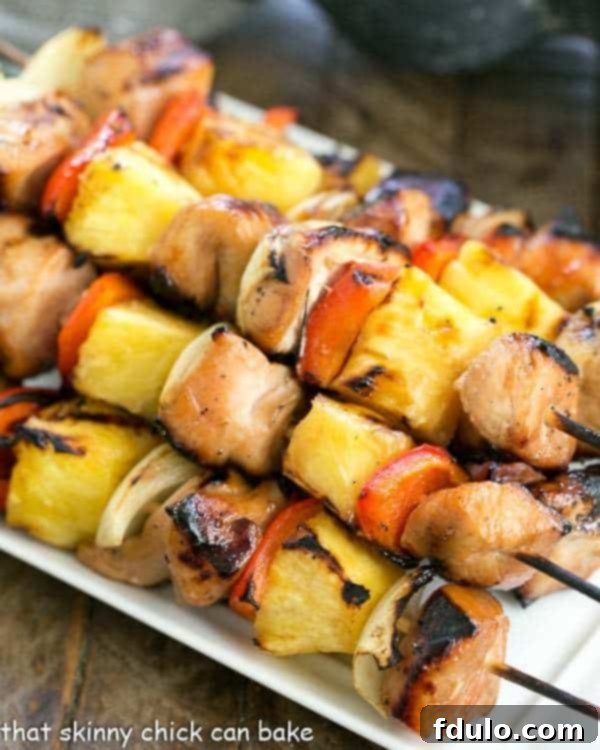 Honey Glazed Chicken Kabobs on a skewer, freshly grilled