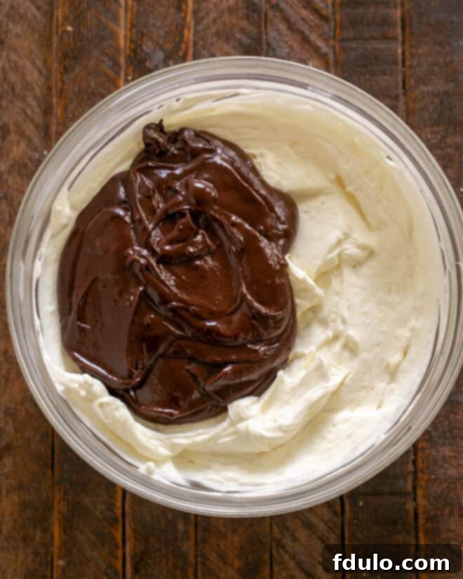Ganache added to whipped cream mixture.