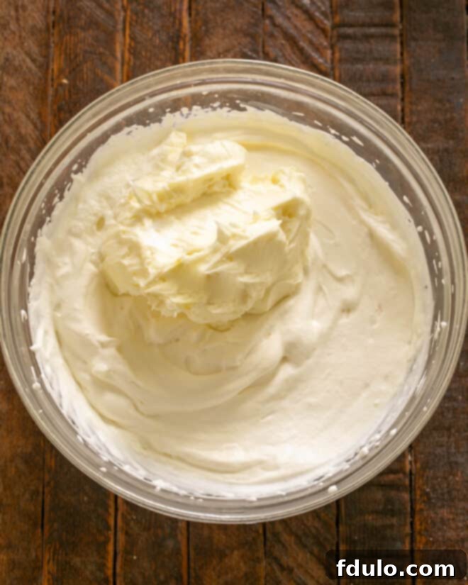 Softened cream cheese added to whipped cream.