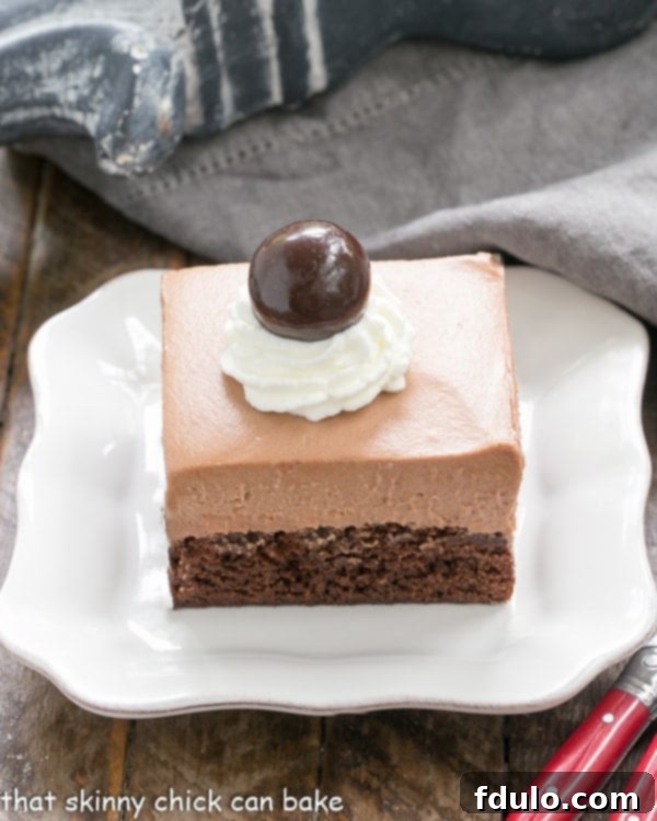 Rich French Silk Pie Brownies served on a pristine white ceramic plate, ready to be enjoyed.