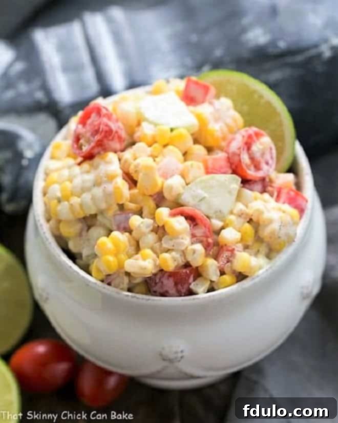 Spicy Mexican Corn Salad, a vibrant dish with charred corn, fresh cilantro, cheese, and a creamy dressing.