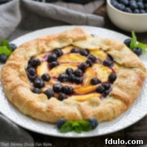Rustic Peach Blueberry Galette 3 Beautiful Peach Blueberry Galette, showcasing a perfect slice and flaky crust.