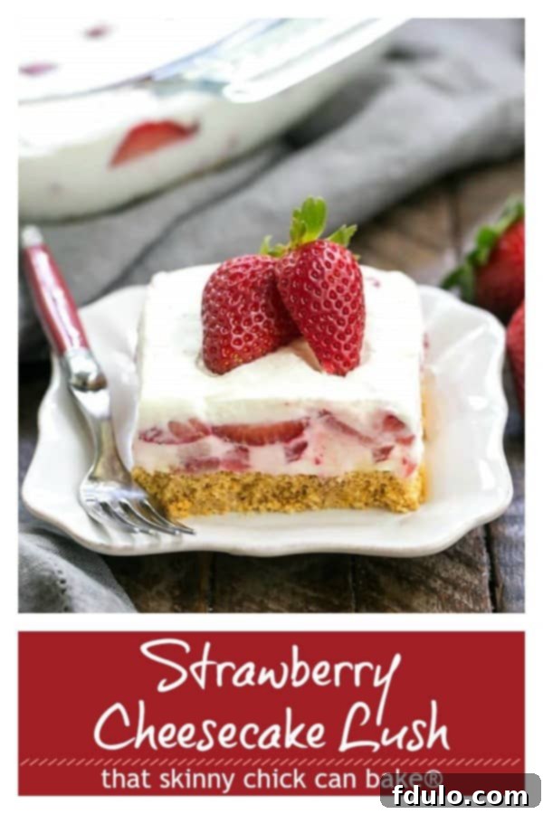 Vibrant close-up of Strawberry Cheesecake Lush Dessert, highlighting the fresh strawberries, creamy layers, and crumbly graham cracker crust. A perfect no-bake summer treat.