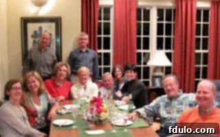 A group of neighbors enjoying conversation around a dining table, having just sampled a delicious apple galette.