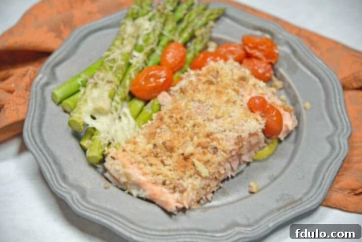 Panko Crusted Salmon on a sheet pan with roasted vegetables.