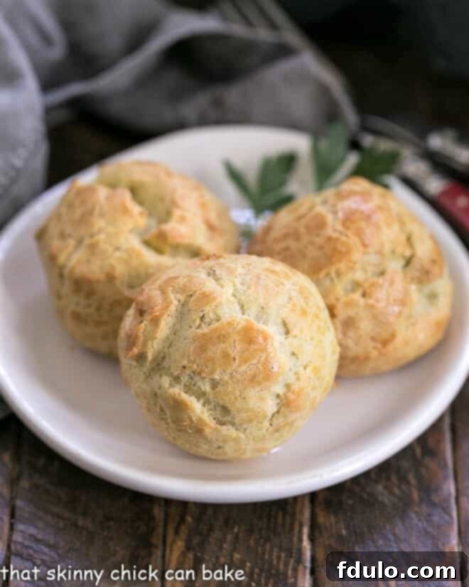 Blue Cheese Gougères arranged beautifully on a small white plate.