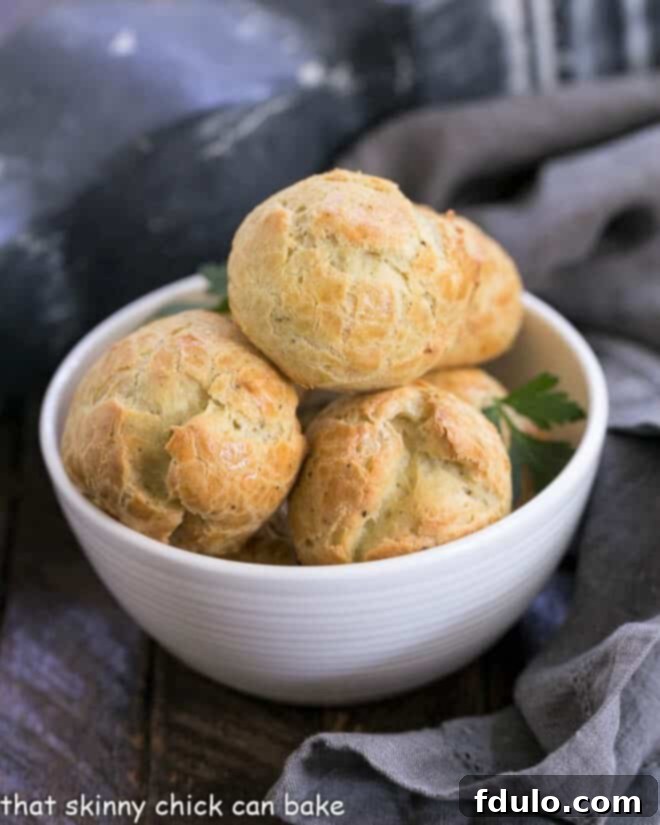 Blue Cheese Gougères in a small white bowl, close-up