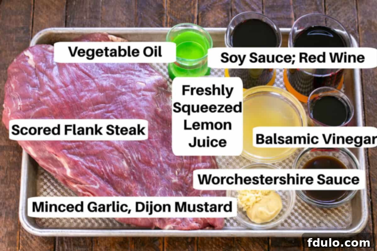 Grilled flank steak marinade ingredients with labels on a sheetpan.