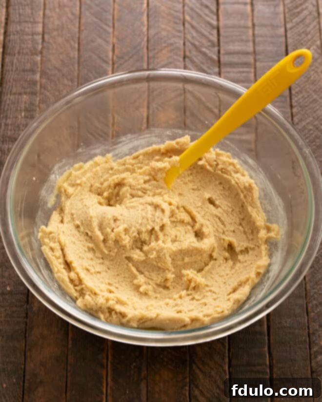 Hearty Cowboy Cookies: The Recipe You Need 5 Step 3: Gradually incorporating the dry flour mixture into the wet ingredients.