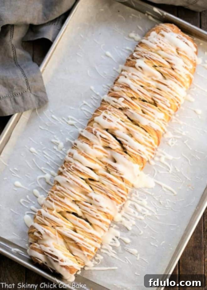 Braided Cinnamon Danish with Laminated Dough on a parchment-lined baking sheet, ready for the oven.