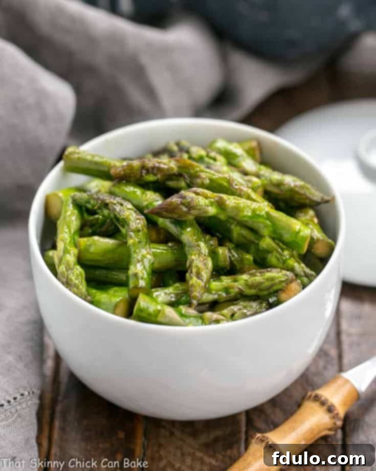 Vibrant Asian Asparagus Stir-fry 4 Asian Stir-Fried Asparagus with a glossy soy, garlic, and sherry glaze, presented in a vibrant recipe image.