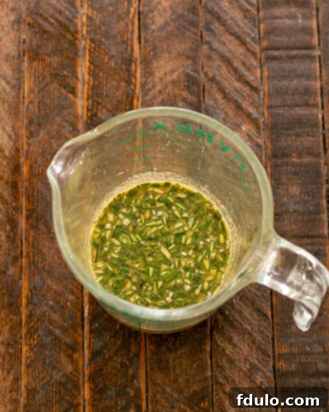 Mixing marinade ingredients in a bowl.