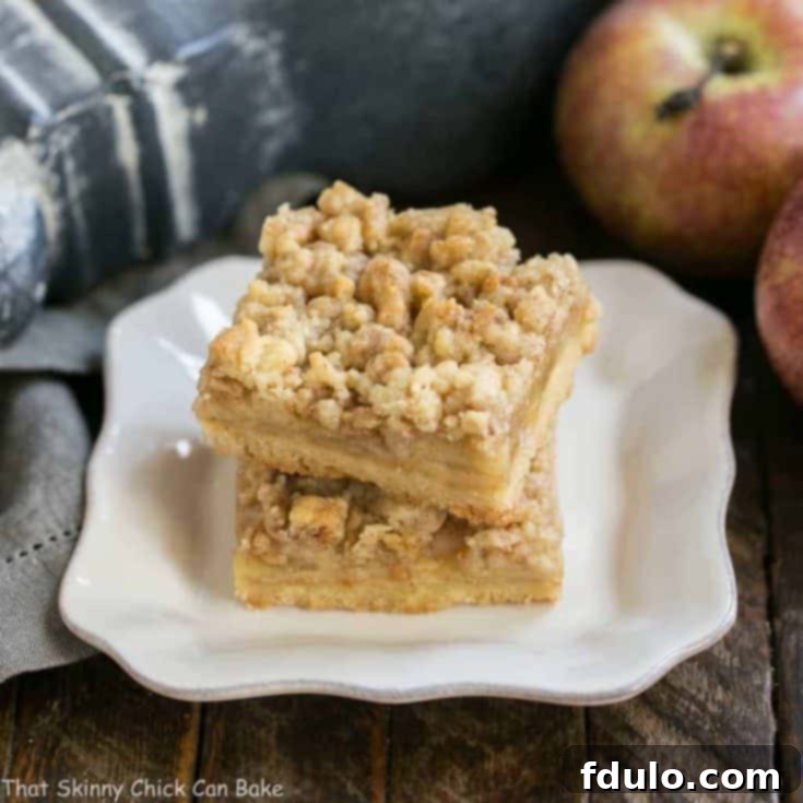 Caramel Apple Pie Bars - Dreamy layers of shortbread, apples, toffee bits and streusel, perfect for fall!