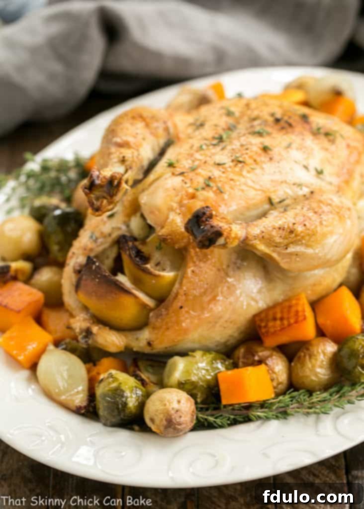 Oven Roasted Chicken with Roasted Fall Vegetables on an oval serving platter