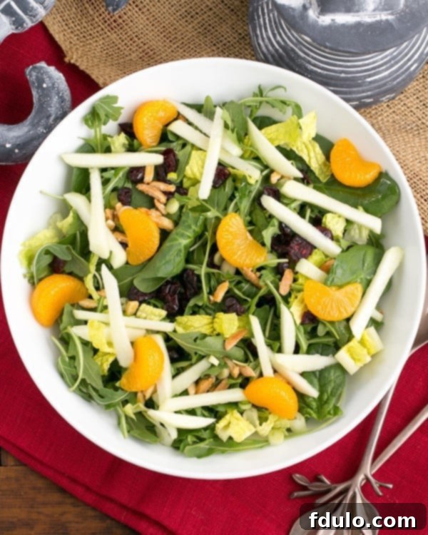 A fresh Holiday Lettuce Salad in a serving bowl.