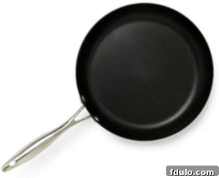 Overhead view of a sleek Scanpan nonstick frying pan, ready for cooking