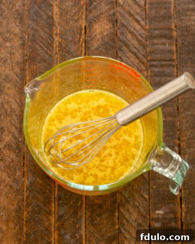 Step 1: Whisk eggs, salt, and sugar together in a bowl.