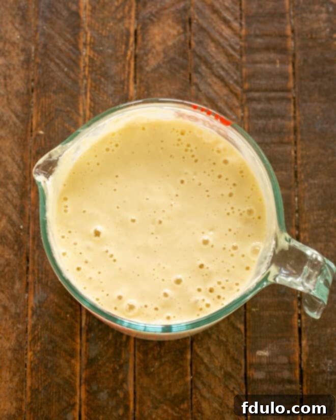 Step 3: Gently fold in the dry ingredients (flour, baking soda, baking powder) into the wet mixture.