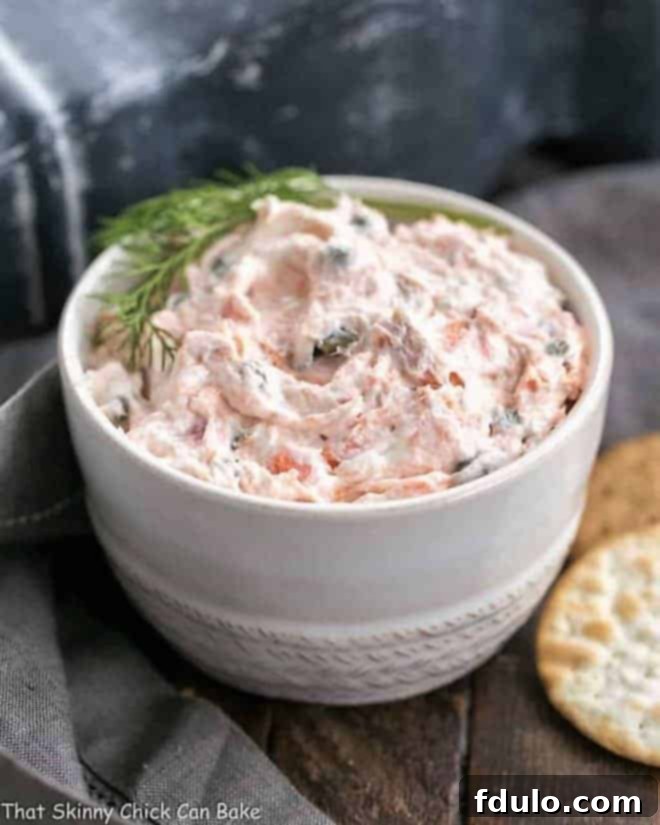 Finished Smoked Salmon Dip garnished and served with crackers.