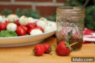 A simple yet elegant serving of the strawberry, mozzarella, and tomato salad