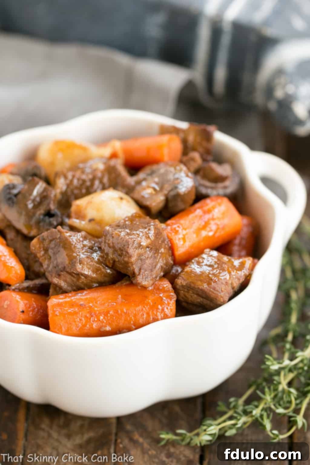 Slow Cooker Beef Stew with Mushrooms - Marvelous comfort food where the crock pot does most of the work! Slow Cooker Beef Stew with Mushrooms in a white bowl.