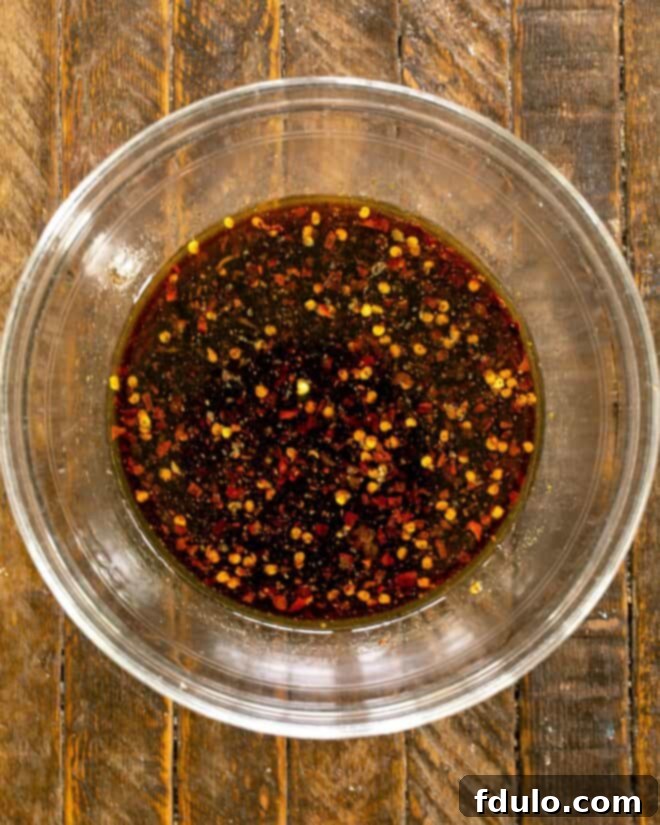 Classic Korean Pork Bulgogi 3 A close-up of the rich, savory Bulgogi marinade in a mixing bowl, ready for the pork to be added.