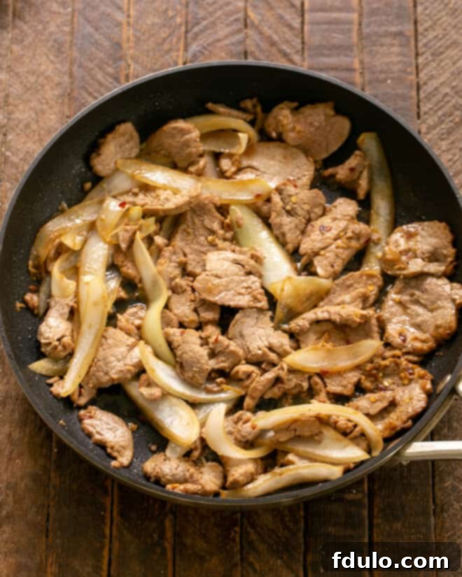 Classic Korean Pork Bulgogi 5 A skillet filled with perfectly sauteed Bulgogi, rich with tender pork and caramelized onions, ready to be served.