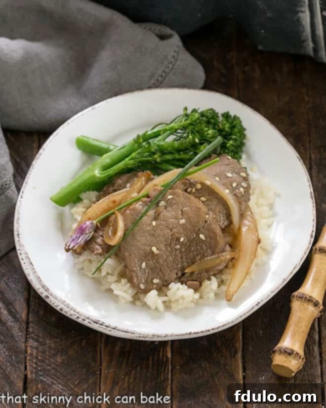 Pork Bulgogi Recipe - a marvelous Korean stir fry with a bit of a kick! An inviting overhead view of Pork Bulgogi arranged artfully on a round white plate, ready to be enjoyed as a gourmet meal.