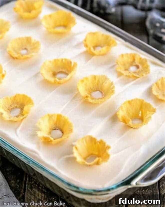 One layer carrot cake topped with creamy cream cheese frosting and beautiful pineapple flowers