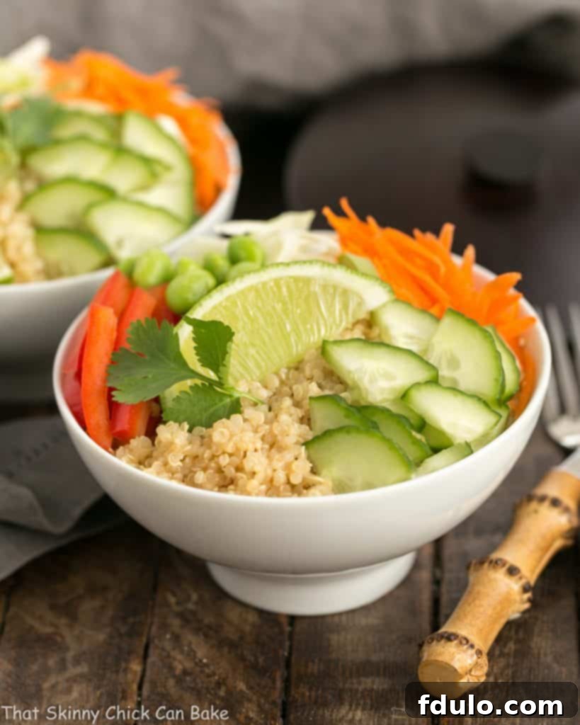 Two Thai Vegetable Quinoa Salad bowls presented side-by-side, ready to be served.