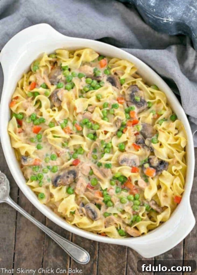 Tuna Noodle Casserole from Scratch in an oval white casserole dish, showcasing creamy noodles and flaked tuna.