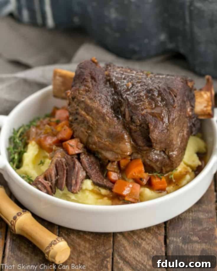 A plate of gourmet Instant Pot Beef Short Ribs served elegantly over mashed potatoes, showcasing the rich sauce and tender meat.