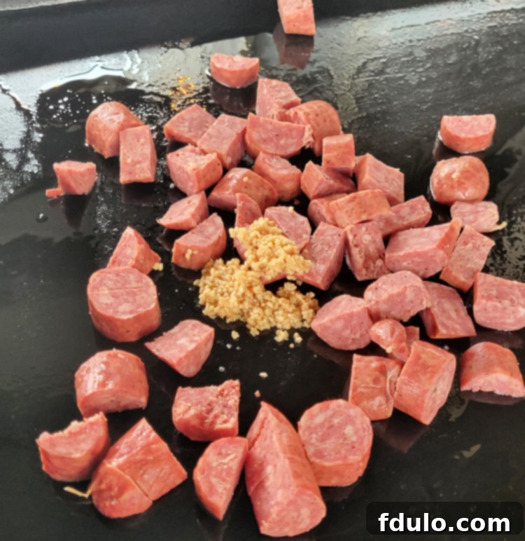 Sausage and Garlic Sautéing on Blackstone Griddle