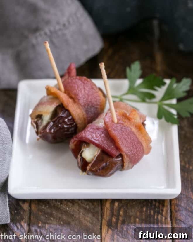 Heavenly Bacon Date Bites 2 Bacon Wrapped Dates on white plate
