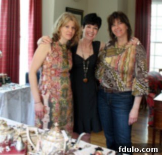 Three sisters smiling warmly, enjoying the festive atmosphere of the jewelry party.