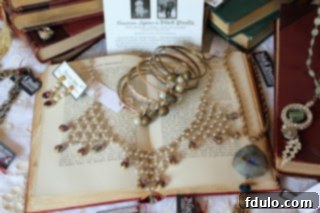Exquisite handmade jewelry displayed elegantly on an open book, showcasing intricate vintage designs.