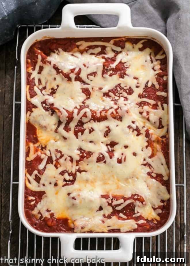 Overhead view of 3 cheese manicotti in a casserole dish.