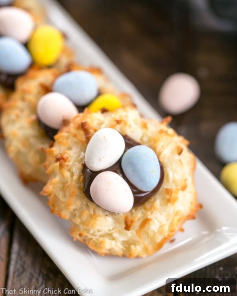 Coconut Macaroon Easter Nests lined up on a thin white tray