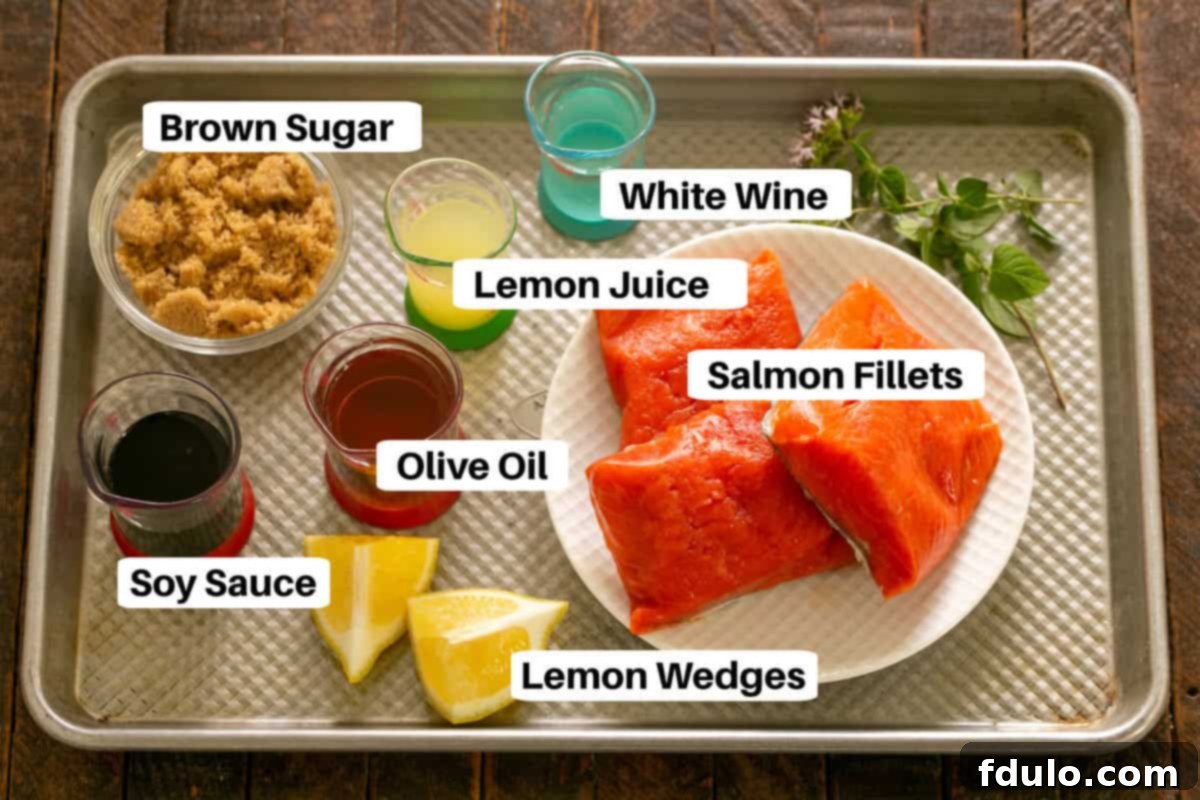 All the essential ingredients for Easy Glazed Salmon, neatly arranged on a sheet pan with clear labels for easy identification.