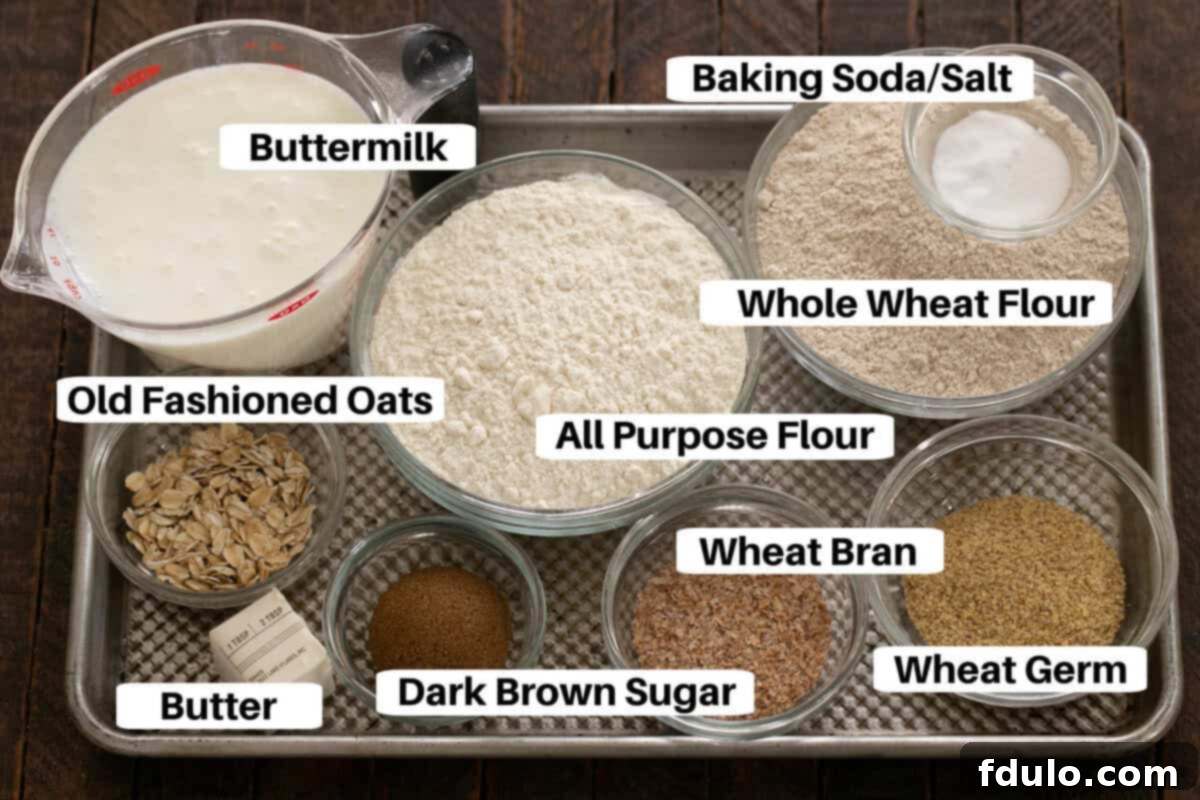 Irish Brown Bread Ingredients laid out on a sheetpan with labels, including flours, oats, butter, and buttermilk.