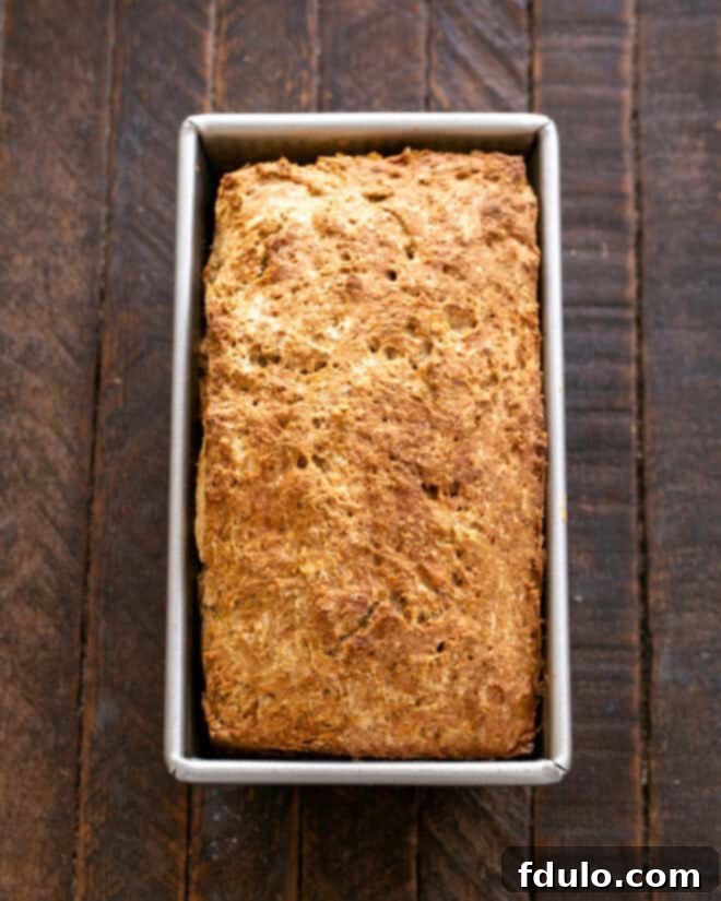 Baked Irish Brown Bread being tested with a toothpick for doneness.
