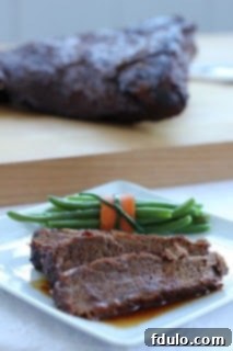 Close-up of tender, slow-cooked brisket slices, perfect for a cozy dinner