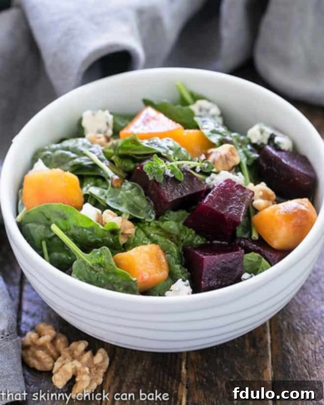 A beautifully presented Peach and Beet Salad in a pristine white salad bowl, showcasing vibrant colors and fresh ingredients, perfect for a summer meal.