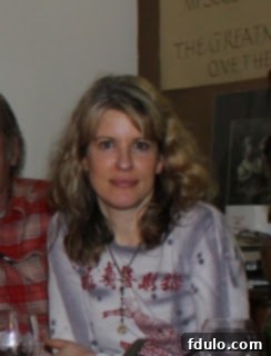 A warm portrait of my sister, Mary, whose culinary passion inspired this exquisite cheesecake recipe.